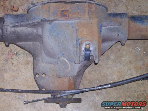 Rusty rear axle differential with brake cable attached
