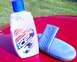 1993 Ford Probe - ICE car wash soap and applicator pad are placed on the hood of a red vehicle.