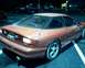 1993 Ford Probe - This 1993 Ford Probe GT is seen from the rear in a dimly lit parking lot.