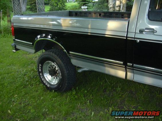 1992 Ford F-250 pickup truck, two-tone paint, side view