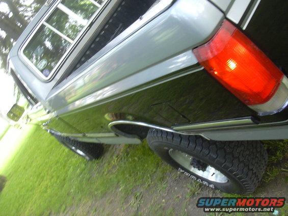 Rear quarter panel and taillight of a 1992 Ford F-250 pickup truck