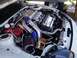 1994 Dodge Stealth - The engine bay shows a complex setup with a prominent supercharger and polished components.