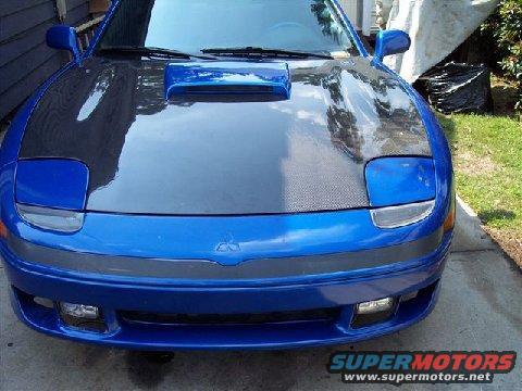 Blue sports car front view, carbon fiber hood, Supermotors logo