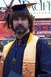 1990 Ford Bronco - A graduate poses for a photo in their academic regalia.