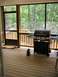 From the screened-in porch, BBQ grill.