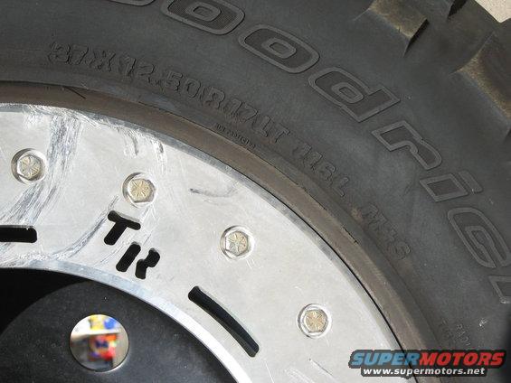 Close-up of a BFGoodrich tire with size 37x12.50R17LT and a polished wheel with hex bolts
