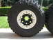 1983 Ferrari Enzo - A close-up view of an off-road tire and a TR beadlock wheel, with another tire visible to the right.