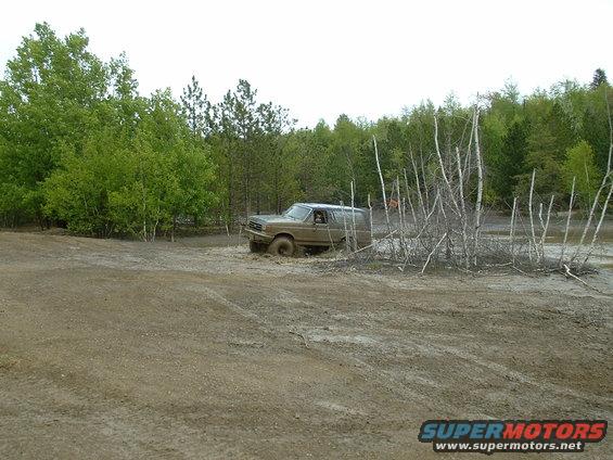 1991 Ford Bronco stuck in mud off-road
