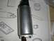 1995 Ford Probe - A silver fuel pump is shown with installation diagrams and part information visible in the background.