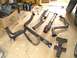 1995 Ford Probe - Various exhaust system parts are displayed on a wooden surface, possibly for a vehicle repair or upgrade.