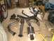 1995 Ford Probe - Various exhaust system components are displayed on a wooden floor, possibly for installation or sale.