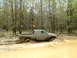 1991 Ford Bronco - Pickup truck navigating a challenging muddy off-road course.