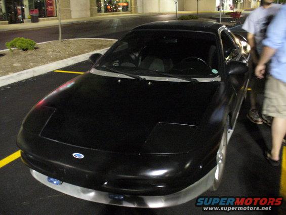 black 1991 Ford Probe parked in a lot at night