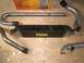 1995 Ford Probe - A TIAL intercooler and several pieces of piping are laid out on a wooden surface.