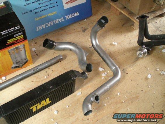 TIAL intercooler and custom piping kit on a wooden surface