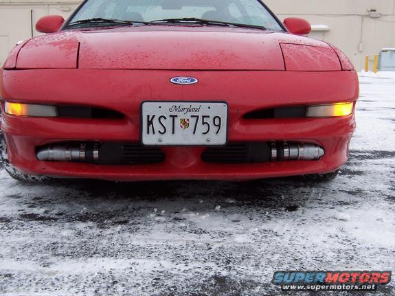 Front view of a red 1995 Ford Probe with a Maryland license plate