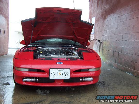 Red 1995 Ford Probe with hood open, front view, showing engine and Maryland license plate KST 759