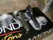 1995 Ford Probe - Close-up of two engine connecting rods placed on a box piston graphics and brand text.