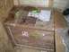 1995 Ford Probe - A wooden crate is packed with items and secured with various shipping labels and markings.