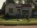 1986 Ford Bronco - A house in a suburban neighborhood with two people, one on a bicycle.