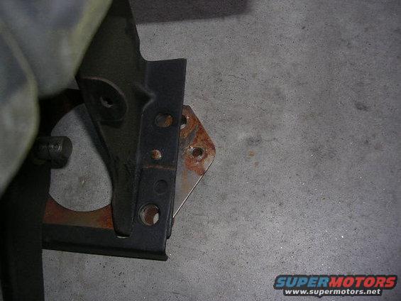 Close-up of clutch pedal assembly part with rust
