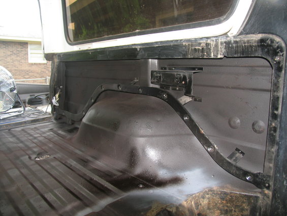 1978 Ford Bronco tub priming, showing the interior of the bed and wheel well