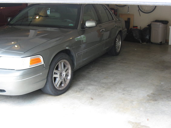 2001 Ford Crown Victoria parked in a garage, front quarter view