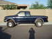 1988 Ford Ranger - This pickup truck is parked on a residential street in front of a house and a wall.