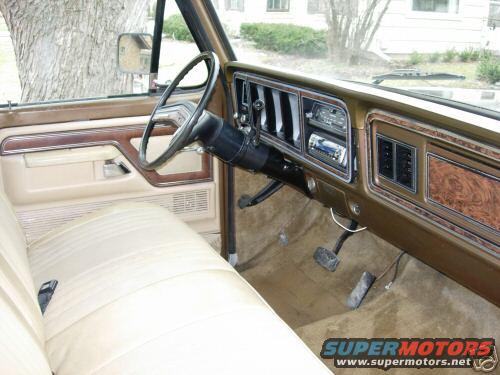 Interior view of a 1979 Ford F-150, showing the dashboard, steering wheel, and seats