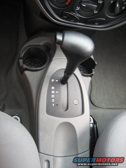 Automatic transmission shifter with P, R, N, D, 2, 1 markings and cup holders
