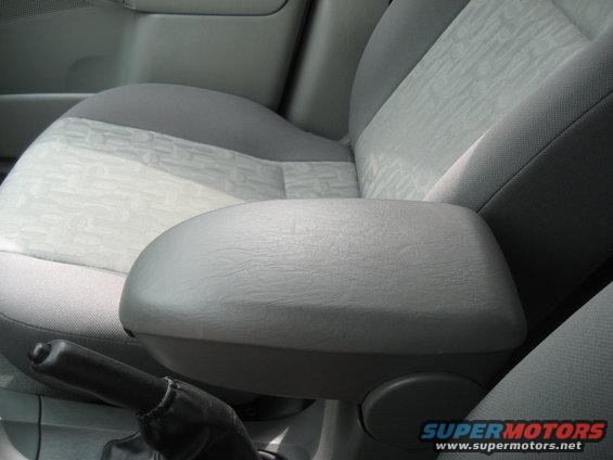 car's center console and passenger seat with patterned fabric