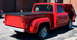 1971 Porsche 914 - A red pickup truck is parked outdoors, showing its rear and side profile with the hood open.