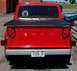 1971 Porsche 914 - Rear view of a red Ford pickup truck a black tonneau cover and a New York commercial license plate.