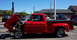 1971 Porsche 914 - A red pickup truck is parked outside with its hood open, revealing the engine compartment.