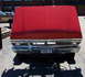 1971 Porsche 914 - This red truck's front end features a prominent chrome grille and a New York license plate, suggesting a 1970 model year.