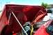 1971 Porsche 914 - The engine bay of a red car is open, revealing the engine and various parts.