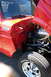 1971 Porsche 914 - Close-up of a red Ford truck's engine bay, revealing the engine and chrome wheels with 'Radial T/A' tires.