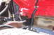 1971 Porsche 914 - This photo shows a portion of a vehicle's chassis, radiator, and some red-painted engine components.