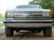 1989 Ford Bronco - Front view of a gray 1987 Ford Bronco, showing its grille and "4x4" badging.