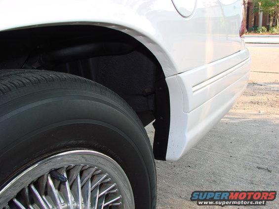 I blacked out the wide section of the bumper cover that shows in the wheel well.  It looked too wide before.