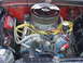 1965 Ford F-100 - Close-up view of a modified engine bay, a chrome air cleaner and custom ignition components.