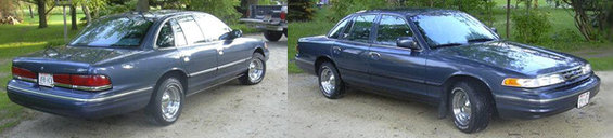 Dark blue 1996 Ford Crown Victoria, 3q-front view. License plate visible