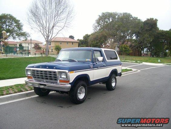 Blue and white 1979 Ford Bronco parked on a street