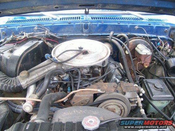 The engine is factory.  The first owner must have added the chrome valve covers.