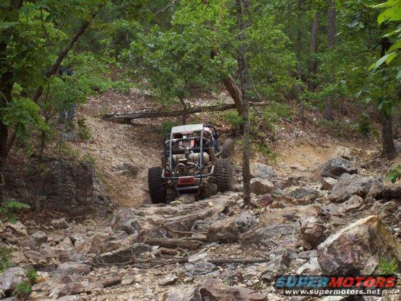 Rear view of off-road buggy on rocky trail