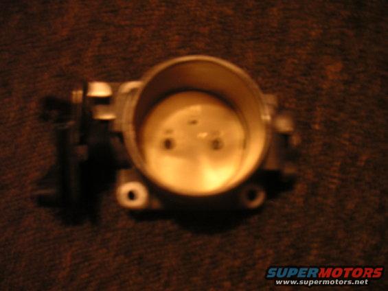 throttle body part on a textured surface