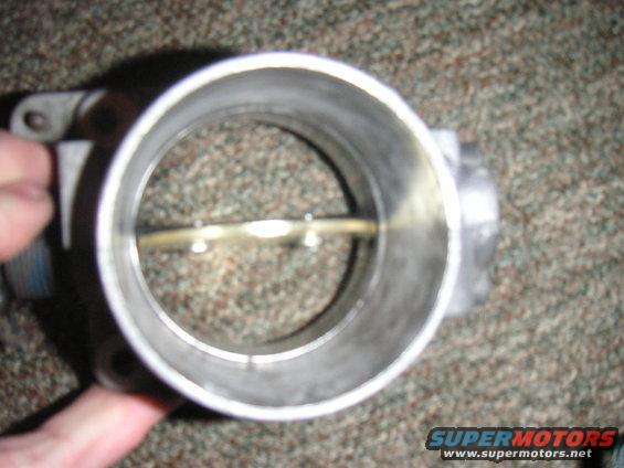 Throttle body with butterfly valve visible