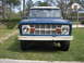 1996 Ford Bronco - This first-generation Ford Bronco features a distinctive white grille and a blue body with a white roof.