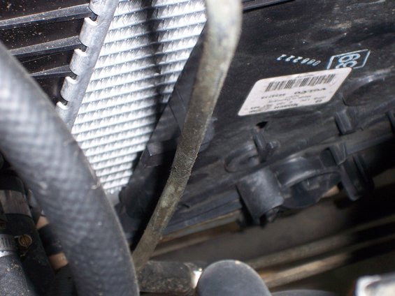 100_3788.jpg The bottom of the fan slides right into the remaining room left on the radiator support. It's just wide enough to cover a majority of the radiator and yet still fit without any modification.