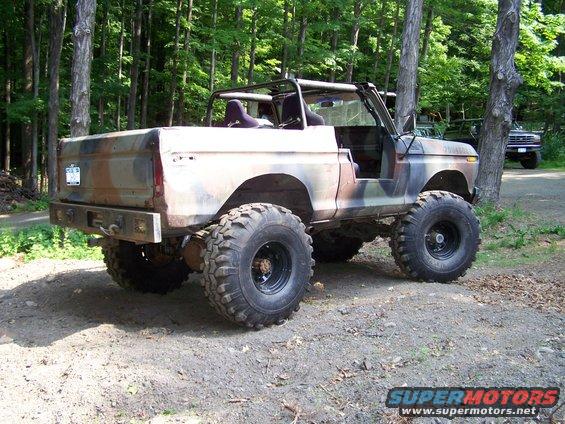 1979 Ford Bronco, camouflaged, topless, with large off-road tires